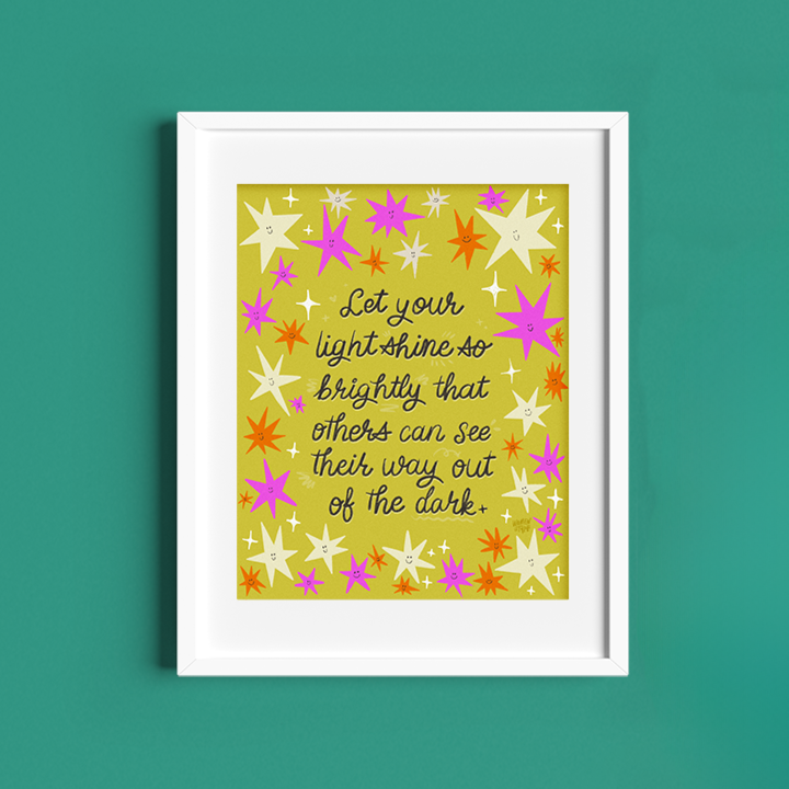 Framed artwork with colorful star pattern and motivational quote on a green background